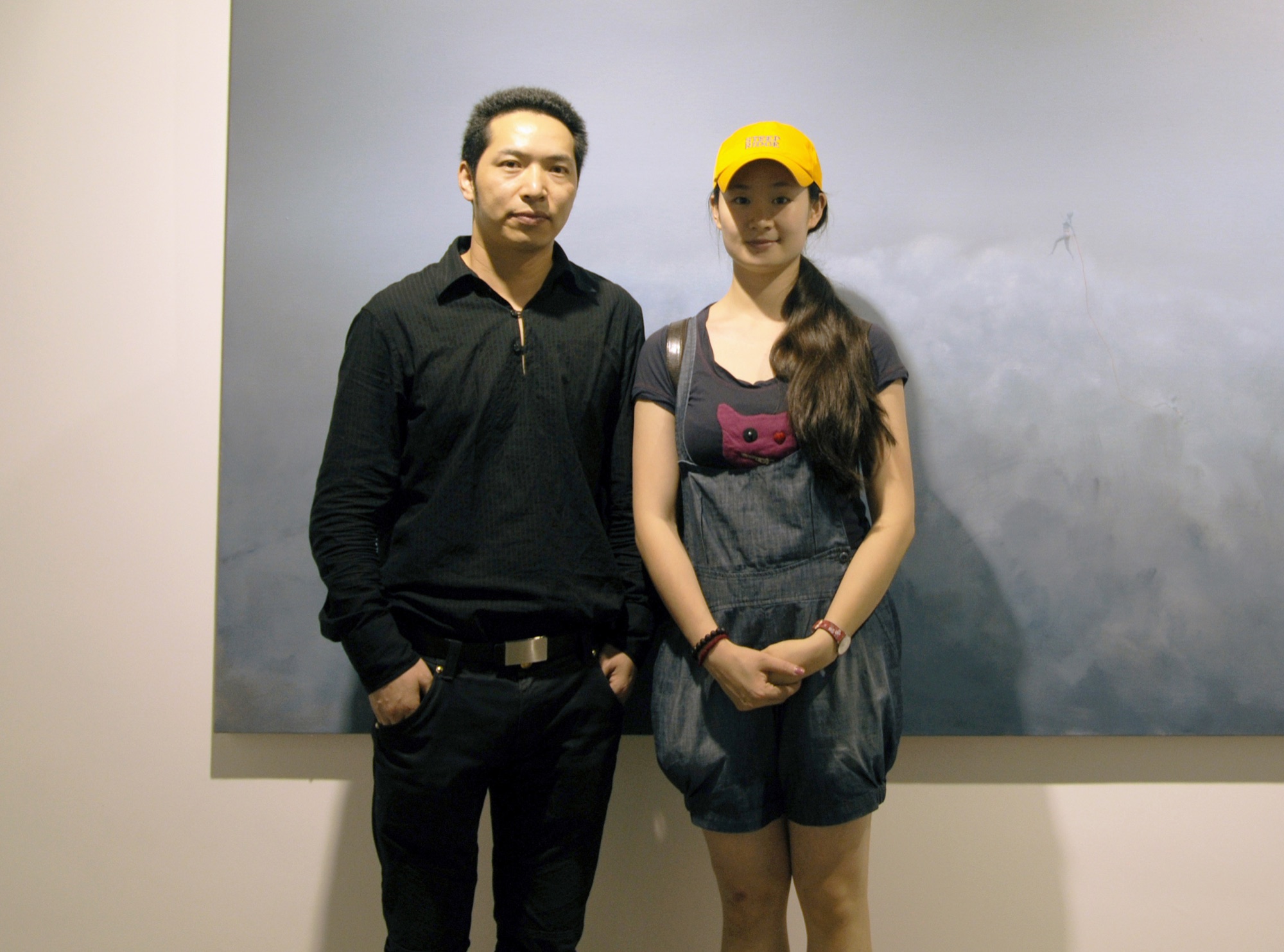 An exhibition photograph with Wang Yabin, according to the supplied annotation.