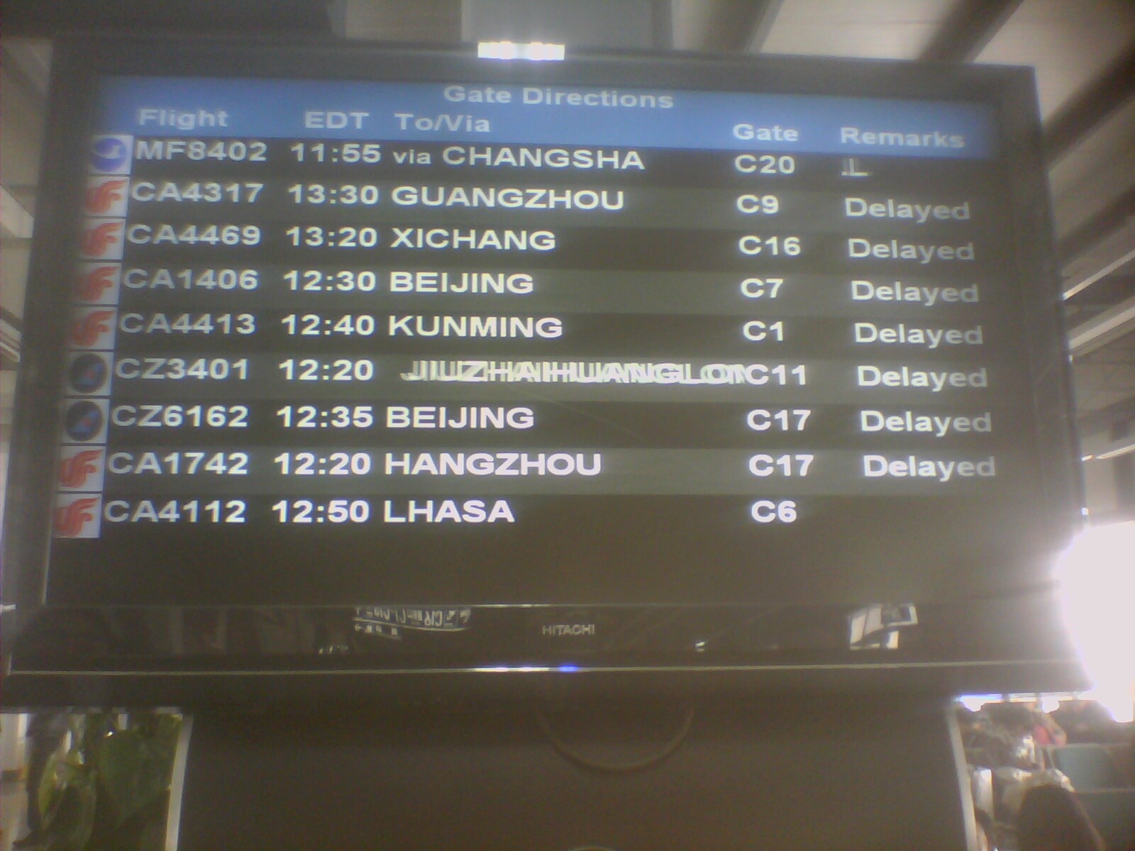Airport departure board; artist-designated cover image.